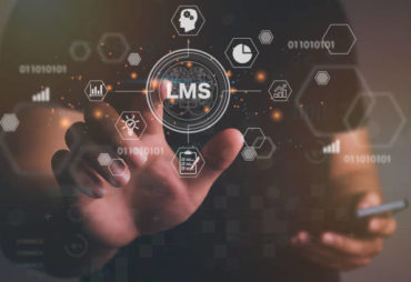 Man hand touching virtual screen to LMS - Learning Management System web icon for lesson and online education, course, application, study, e learning, knowledge everywhere and every time.